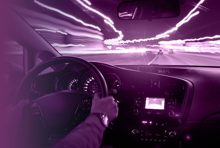 Purple tinted image of a driver